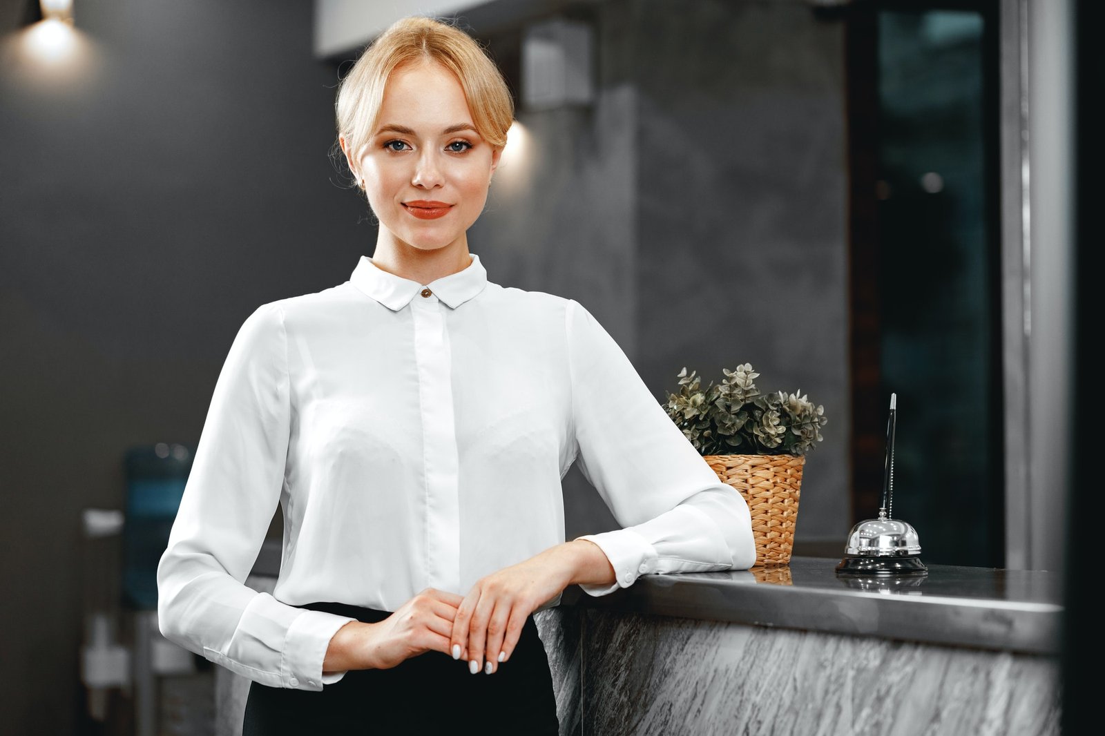 Portrait of beautiful blonde woman hotel receptionist